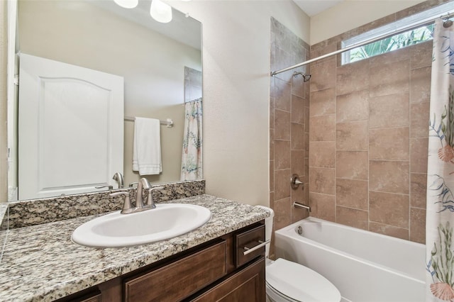 full bathroom with toilet, vanity, and shower / bathtub combination with curtain