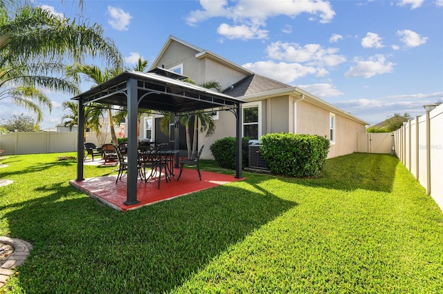 rear view of property with a lawn and a patio area