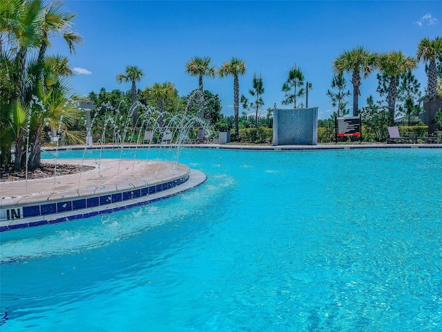 view of pool with pool water feature