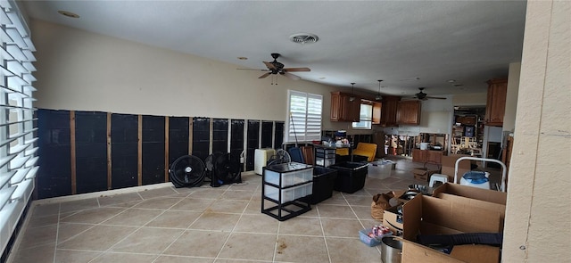 tiled living room featuring ceiling fan