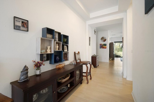 corridor with light hardwood / wood-style flooring