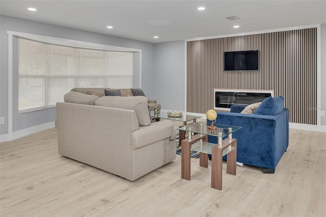 living room with light hardwood / wood-style flooring