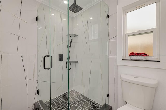 bathroom with crown molding, toilet, and walk in shower