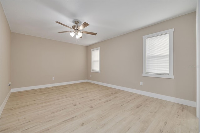 spare room featuring light hardwood / wood-style flooring and ceiling fan