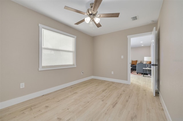 spare room featuring ceiling fan and light hardwood / wood-style floors