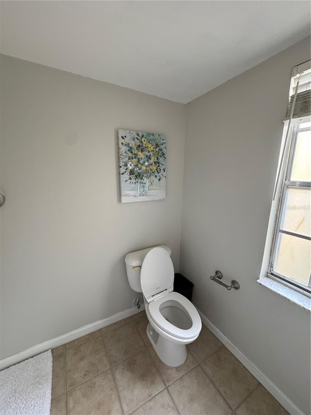 bathroom with tile patterned floors and toilet