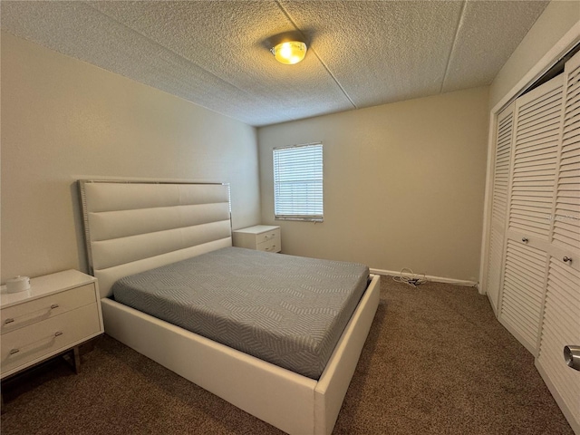 carpeted bedroom featuring a closet and a textured ceiling