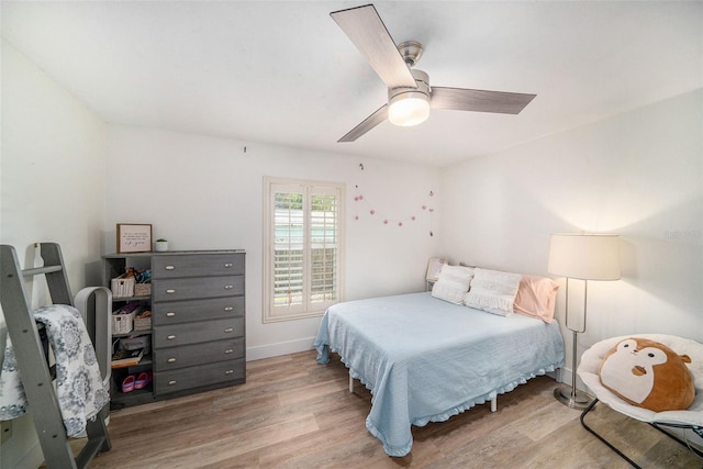 bedroom with hardwood / wood-style flooring and ceiling fan