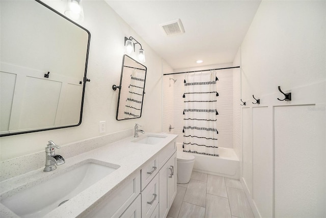 full bathroom featuring vanity, shower / tub combo with curtain, and toilet