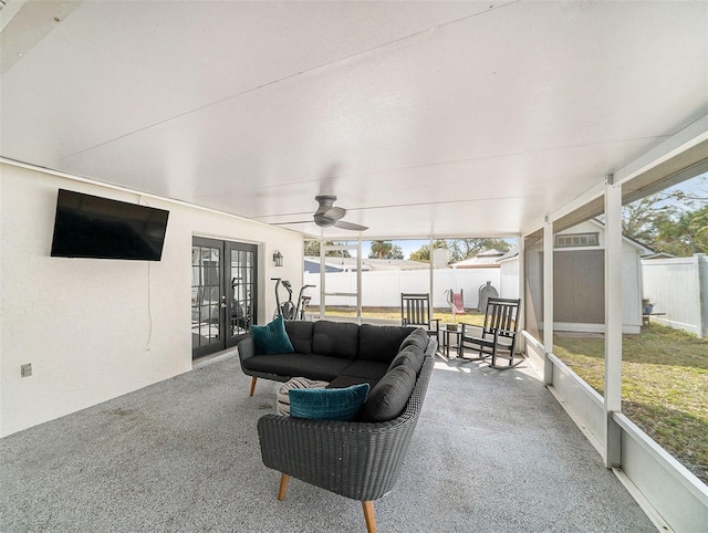 sunroom with french doors, ceiling fan, and a wealth of natural light