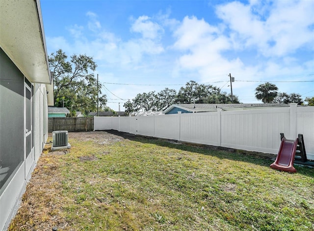 view of yard with central AC