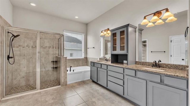 bathroom featuring vanity, separate shower and tub, and tile patterned flooring