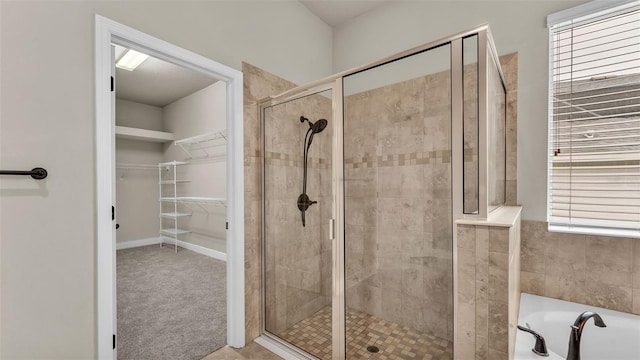 bathroom featuring separate shower and tub