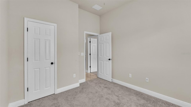 unfurnished bedroom with light carpet