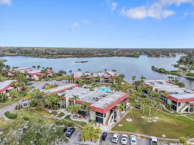 birds eye view of property with a water view