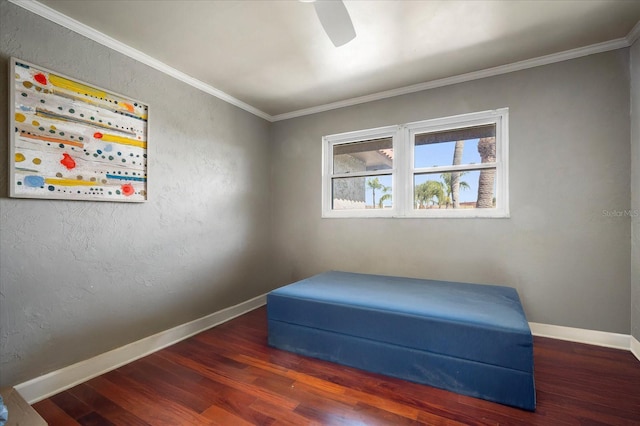 sitting room featuring dark wood-type flooring and ornamental molding