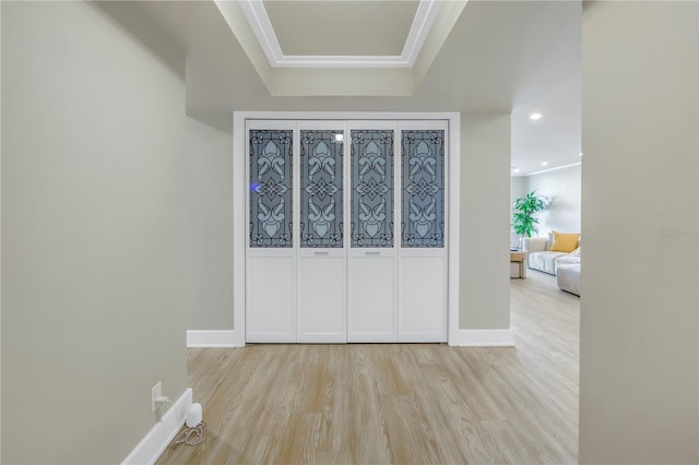 corridor with light hardwood / wood-style floors