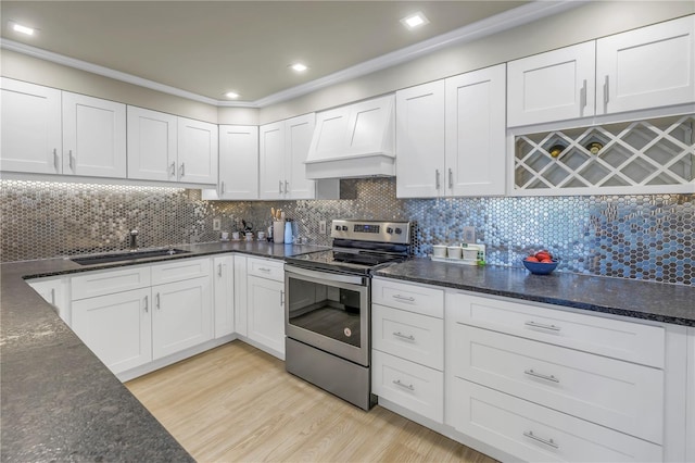 kitchen featuring sink, stainless steel electric range, light hardwood / wood-style flooring, white cabinets, and custom exhaust hood