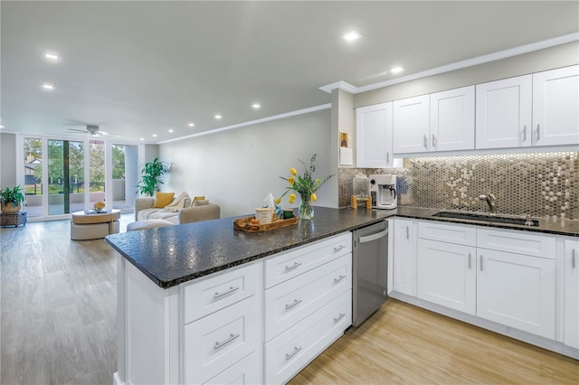 kitchen featuring dishwasher, white cabinets, and kitchen peninsula