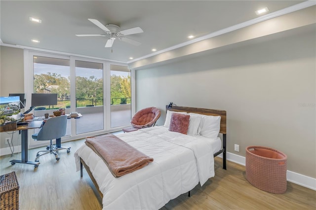 bedroom with light hardwood / wood-style flooring and access to outside