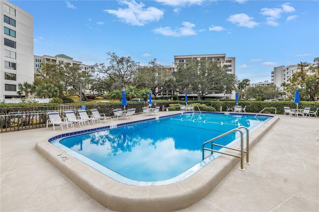 view of swimming pool featuring a patio area