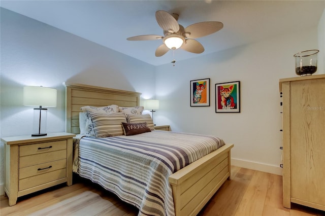 bedroom featuring light hardwood / wood-style floors and ceiling fan