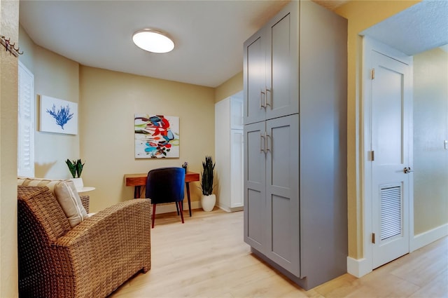 hallway featuring light wood-type flooring