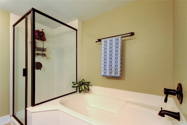 bathroom featuring plus walk in shower