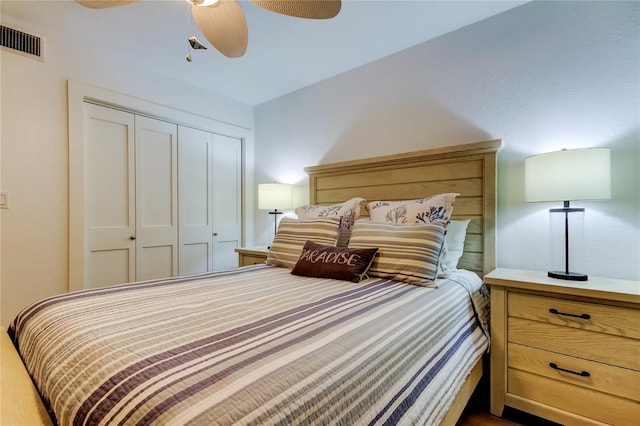 bedroom with ceiling fan and a closet