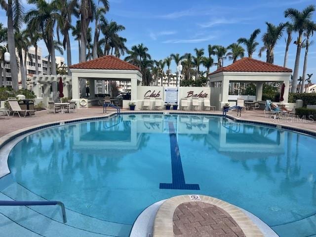 view of swimming pool with a gazebo and a patio