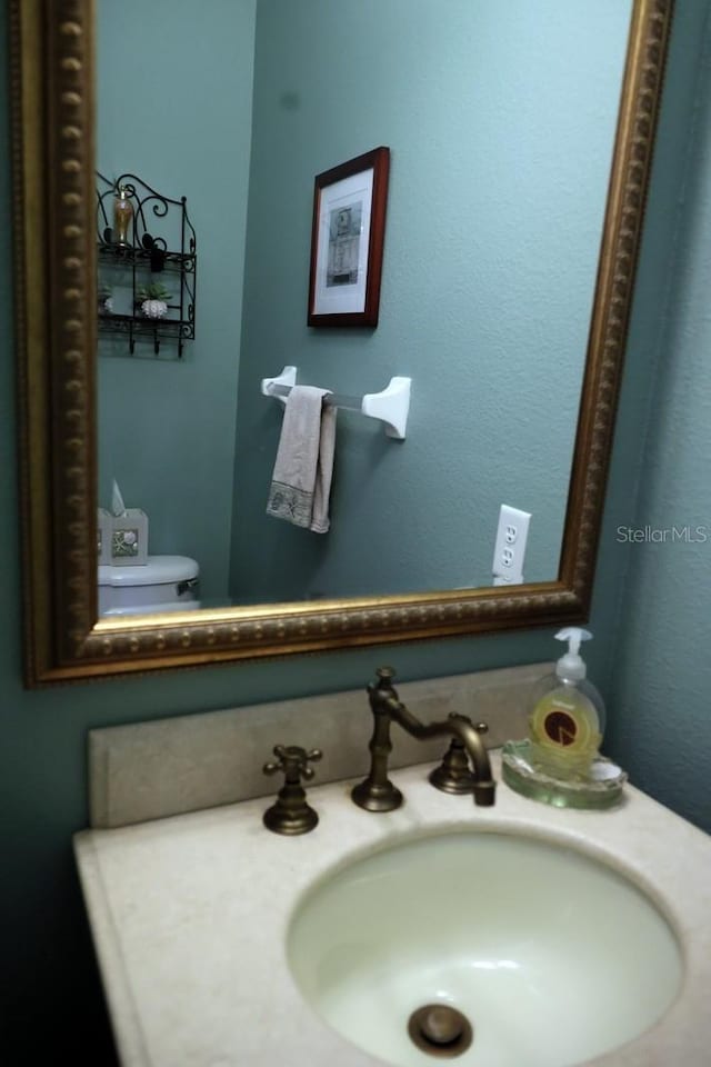 bathroom with vanity and toilet