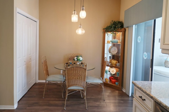 dining space featuring dark hardwood / wood-style flooring