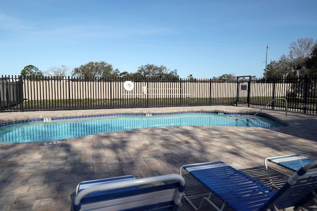 view of swimming pool with a patio