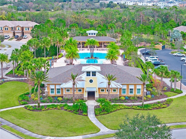 aerial view of property and surrounding area with a pool area