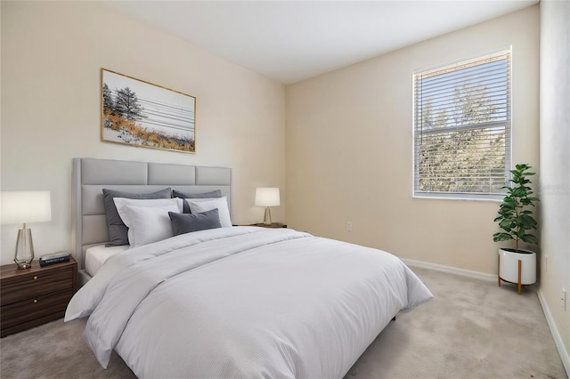 bedroom featuring light colored carpet