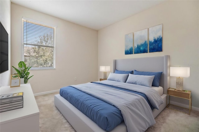 bedroom with light colored carpet