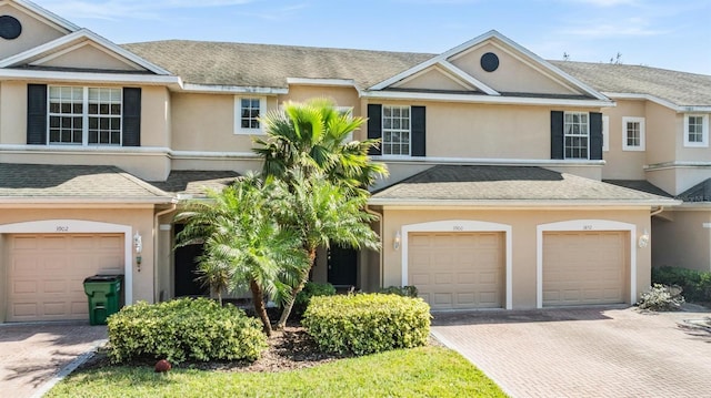 townhome / multi-family property featuring a garage