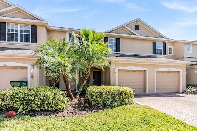 multi unit property featuring a garage