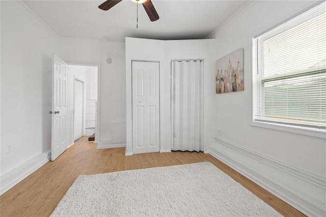 bedroom featuring light hardwood / wood-style floors and ceiling fan