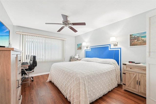 bedroom with ceiling fan and dark hardwood / wood-style flooring