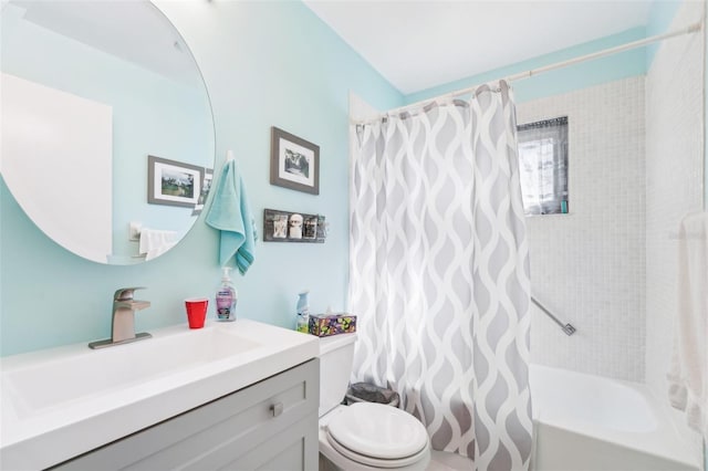 full bathroom featuring vanity, shower / bathtub combination with curtain, and toilet