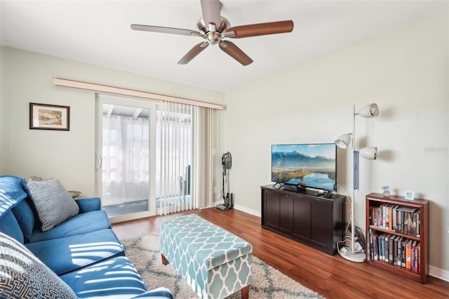 living room with hardwood / wood-style flooring and ceiling fan