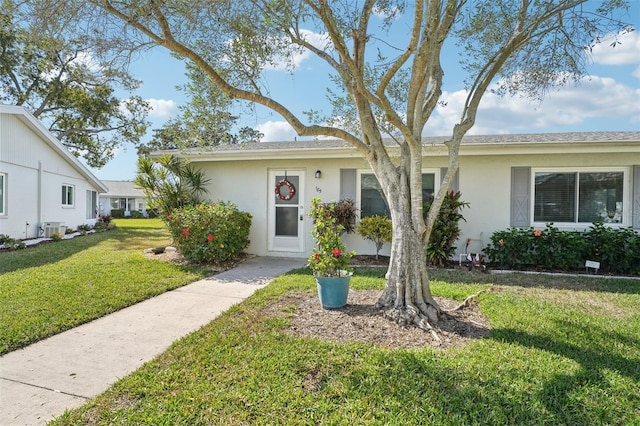 single story home featuring a front yard