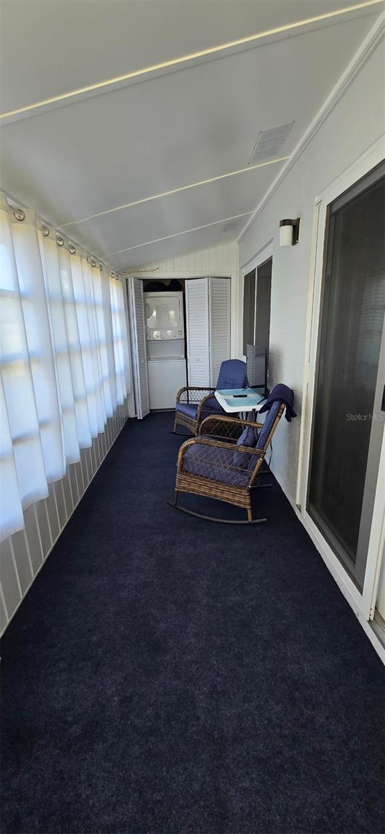 301 Andover Pl S Unit 185, Sun City Center, FL 33573 - sunroom featuring visible vents and vaulted ceiling