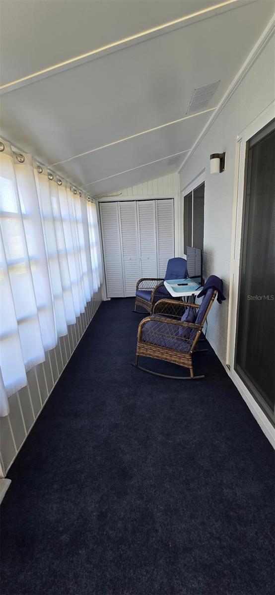 301 Andover Pl S Unit 185, Sun City Center, FL 33573 - sunroom with visible vents and vaulted ceiling