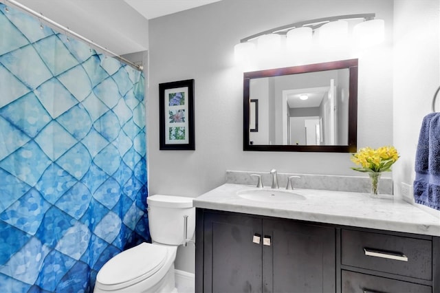 bathroom with a shower with curtain, vanity, and toilet