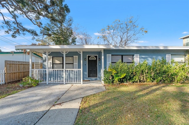 view of front of home with a porch and a front lawn