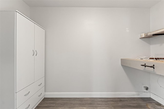 washroom with cabinets, dark hardwood / wood-style floors, and hookup for an electric dryer