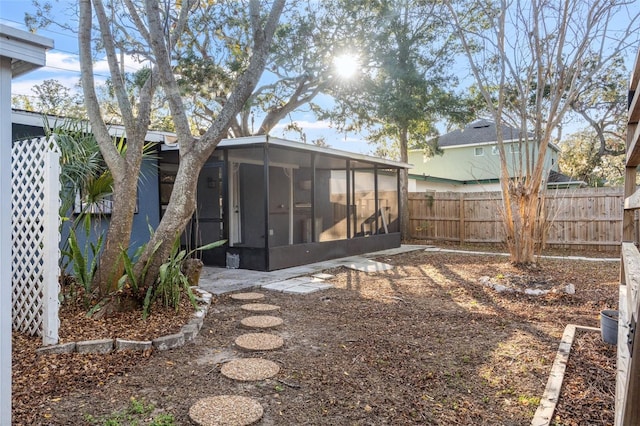 view of yard with a sunroom