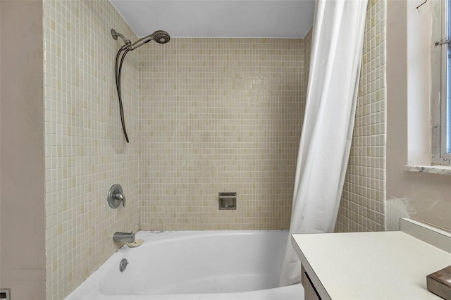 bathroom with vanity and shower / bathtub combination with curtain